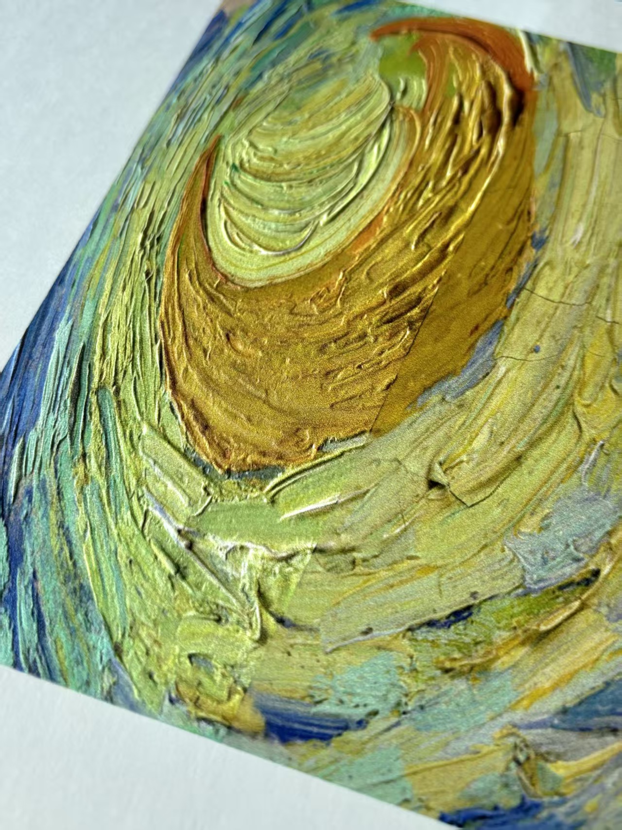 Angled close-up showing the relief of a textured edition